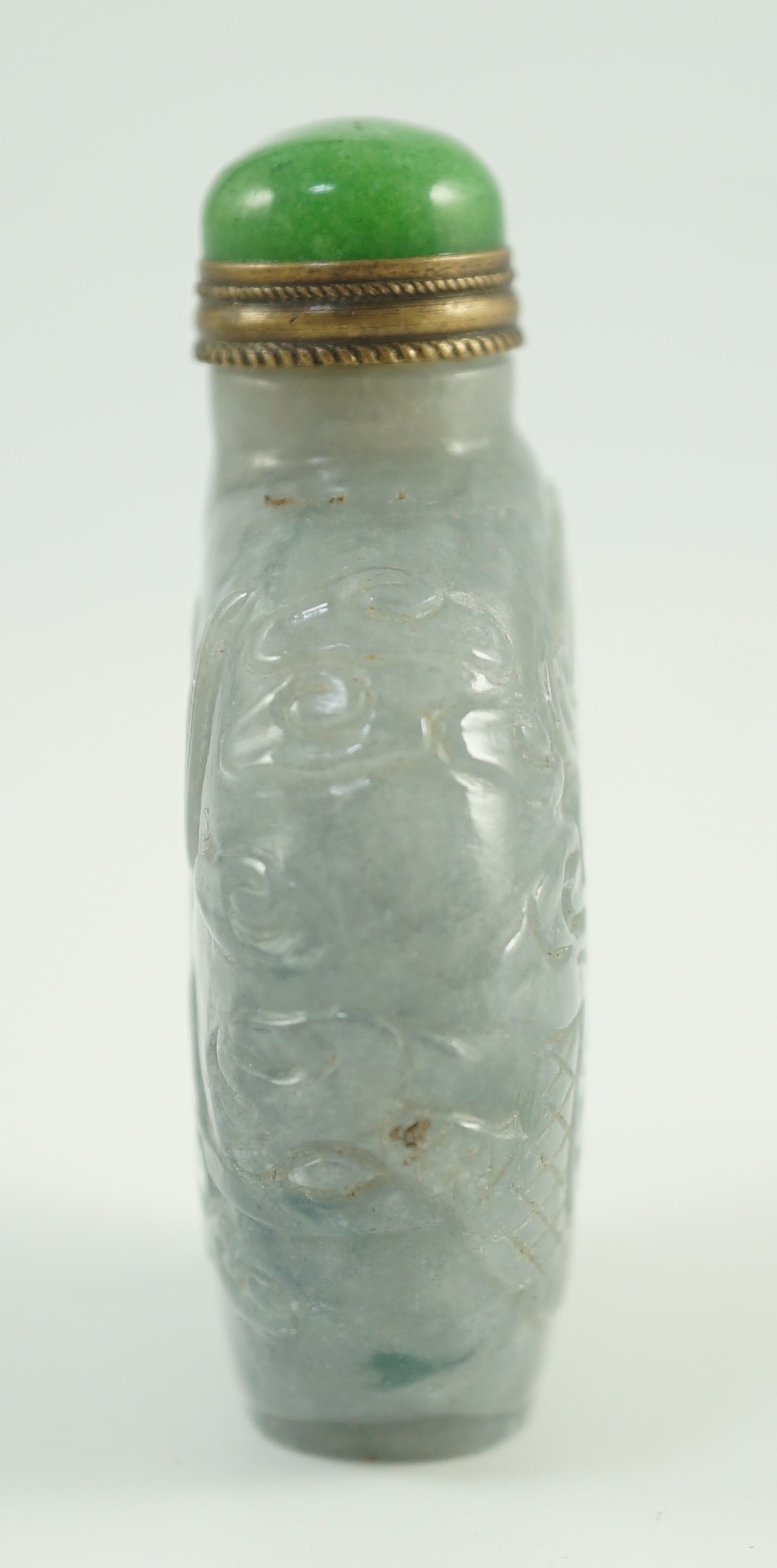 A Chinese jadeite ‘dragon’ snuff bottle, c.1800-1900, 4.9cm high, jadeite mounted stopper